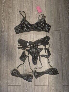3 piece black wet-look faux leather lingerie set featuring gold O-ring hardware